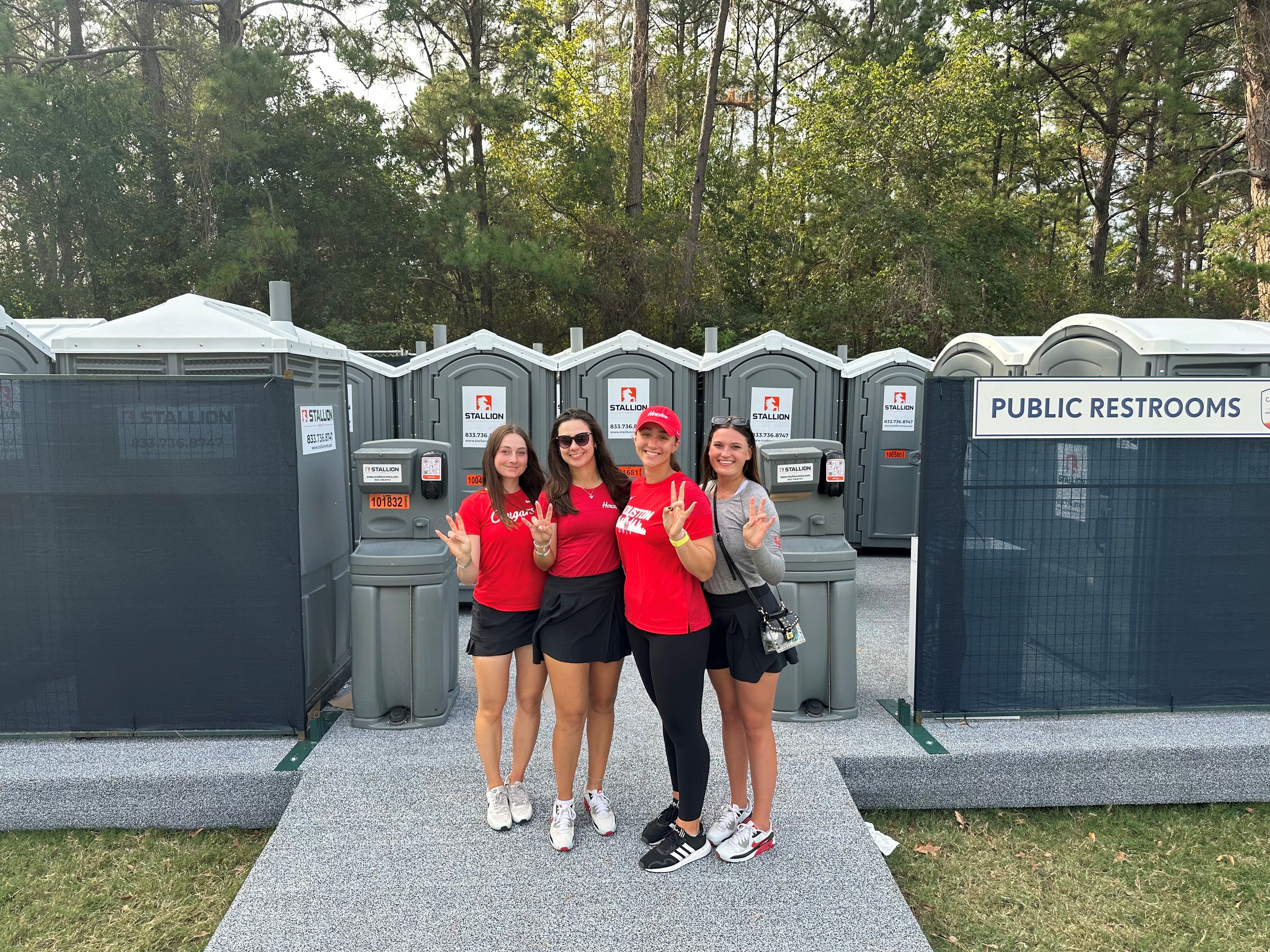 UH Ladies Golf in front of Stallion Portable Restrooms at Houston Open
